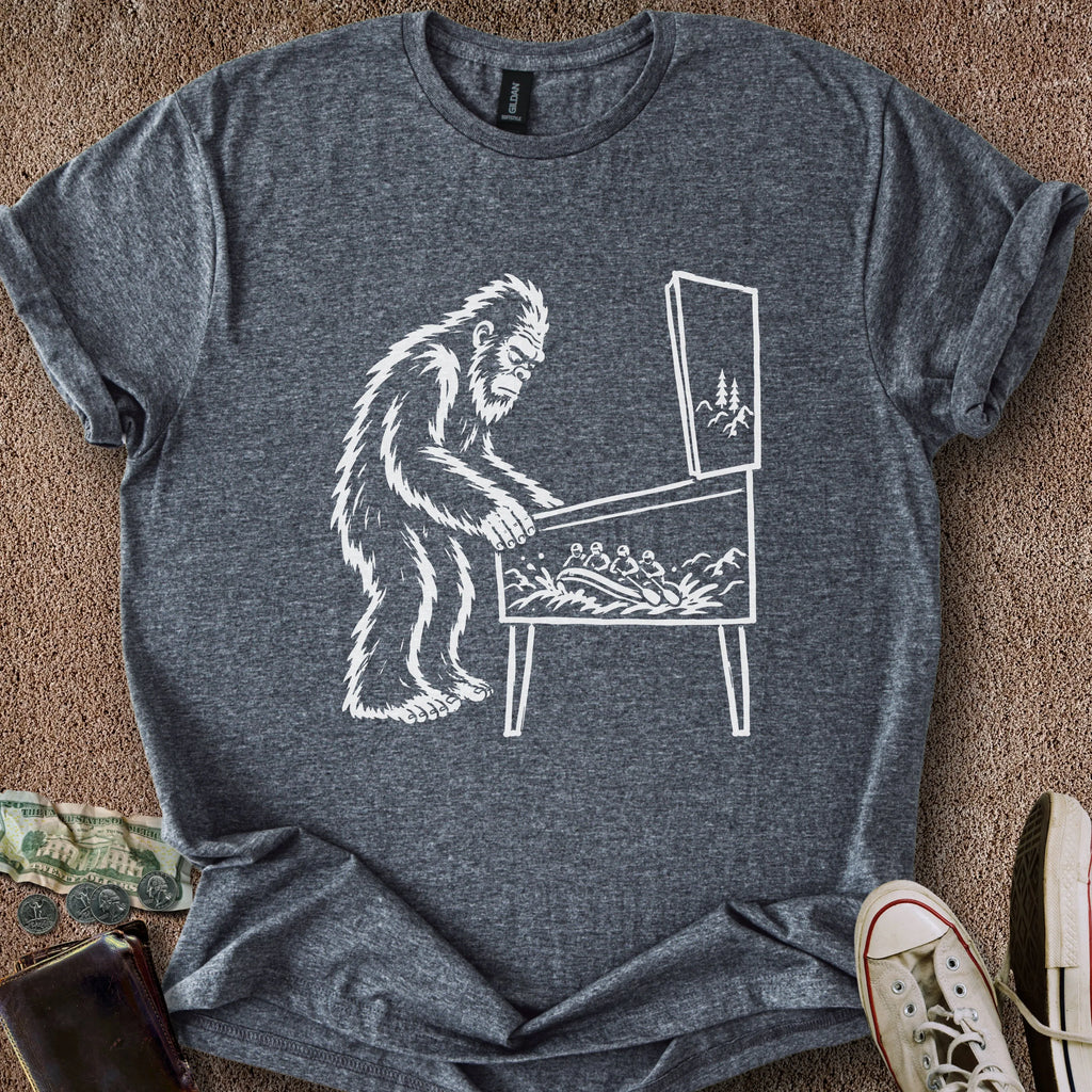 Printify T-Shirt Dark Heather / S 0182_bigfoot playing pinball T-Shirt